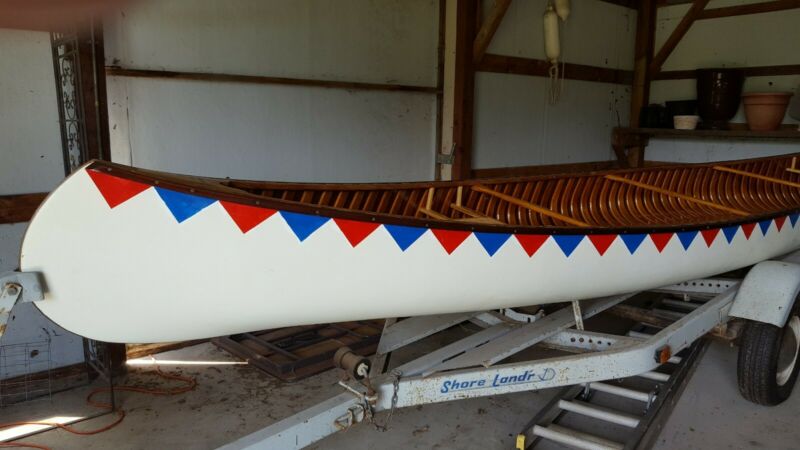 20' old town wood/canvas canoe with paddles and