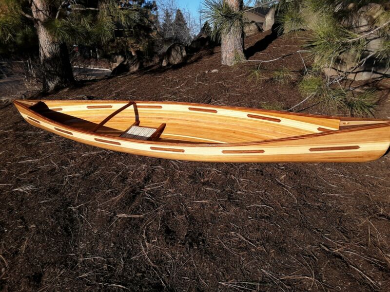 single cedar strip canoe brand new!! 23 pounds! wood